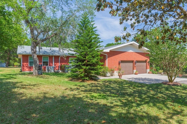 ranch-style house featuring brick siding, a front lawn, and driveway