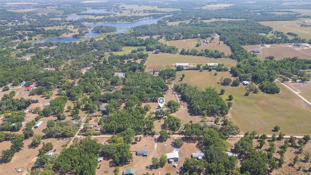drone / aerial view with a water view and a rural view