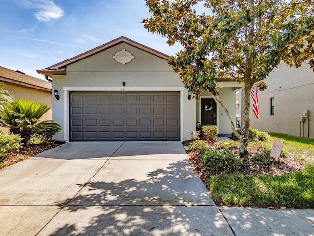 4516 Savannah Holly Pl, Riverview, FL 33578 - ranch-style home with concrete driveway, an attached garage, and stucco siding