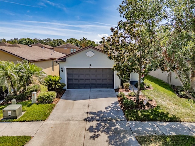 4516 Savannah Holly Pl, Riverview, FL 33578 - ranch-style home with an attached garage, stucco siding, and concrete driveway