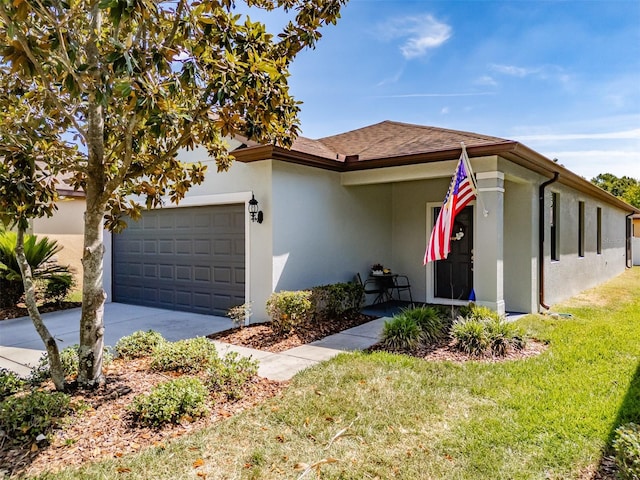 4516 Savannah Holly Pl, Riverview, FL 33578 - view of front facade featuring a front lawn, driveway, a shingled roof, a garage, and stucco siding