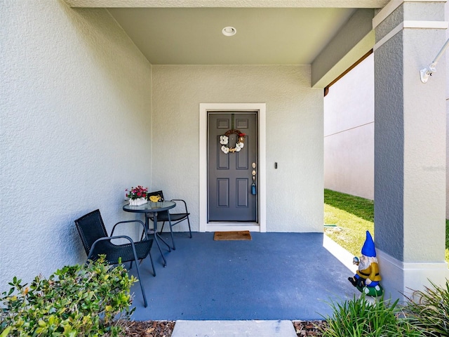 4516 Savannah Holly Pl, Riverview, FL 33578 - view of exterior entry featuring covered porch and stucco siding