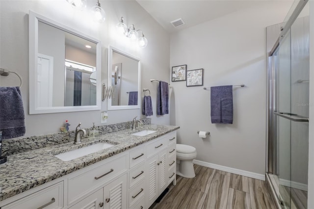 4516 Savannah Holly Pl, Riverview, FL 33578 - bathroom featuring visible vents, a sink, double vanity, and toilet