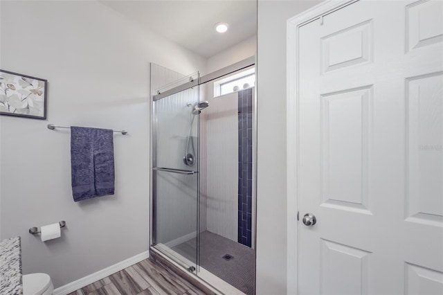 4516 Savannah Holly Pl, Riverview, FL 33578 - full bath with toilet, wood finished floors, baseboards, and a stall shower