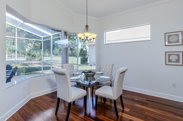 dining room with crown molding, a sunroom, wood finished floors, and baseboards