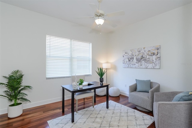 office area featuring baseboards, wood finished floors, and a ceiling fan