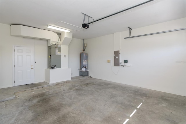 garage featuring heating unit, electric panel, water heater, and a garage door opener