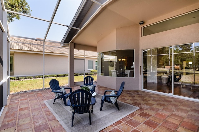 view of patio / terrace with a lanai