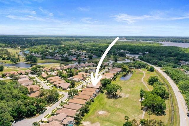 aerial view featuring a residential view, a water view, and view of golf course