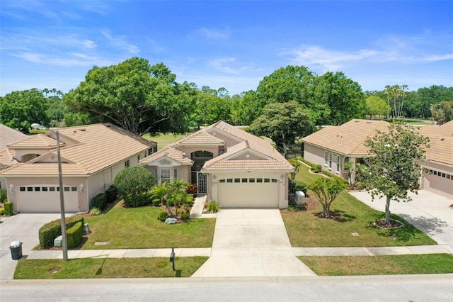 ranch-style house with a front lawn, stucco siding, concrete driveway, and a tiled roof