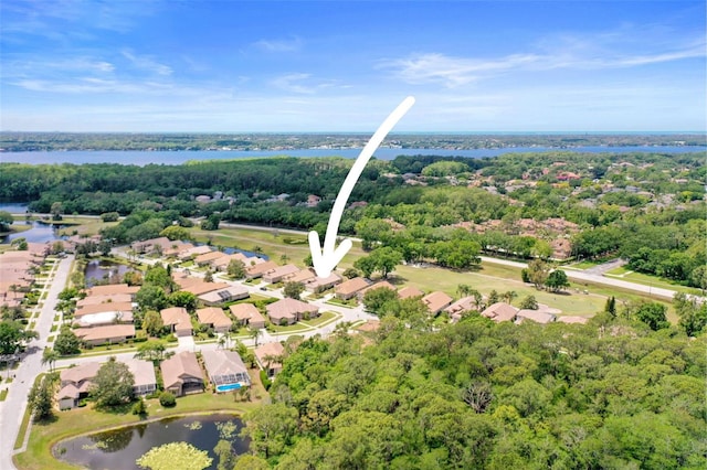 bird's eye view with a residential view and a water view