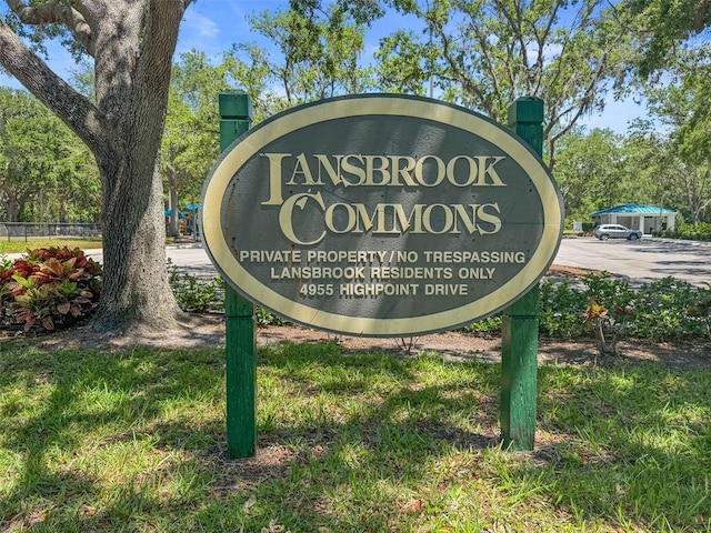 community sign with fence