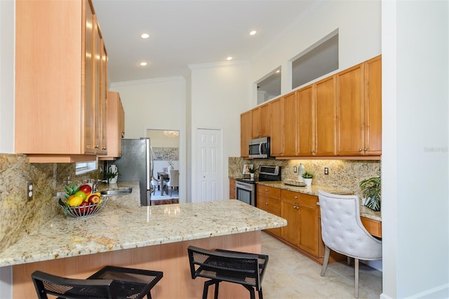 3964 Silk Oak Ln, Palm Harbor, FL 34685 - kitchen featuring appliances with stainless steel finishes, a peninsula, crown molding, a kitchen breakfast bar, and light stone countertops