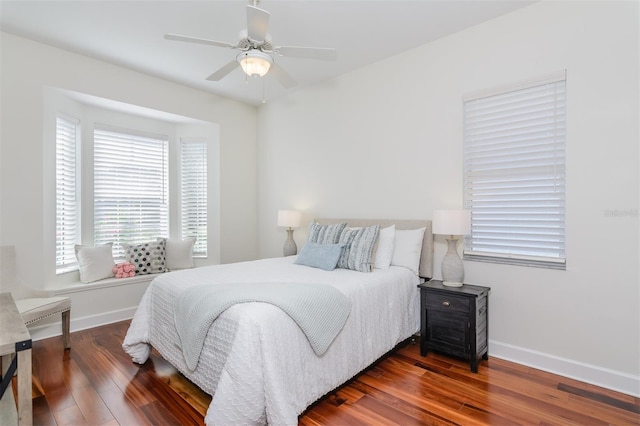 3964 Silk Oak Ln, Palm Harbor, FL 34685 - bedroom with wood finished floors, baseboards, and a ceiling fan
