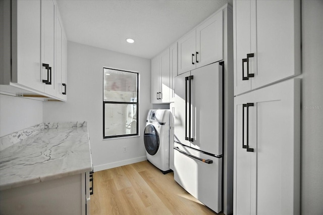 6627 Dolphin Cove Dr, Apollo Beach, FL 33572 - laundry area with washer / clothes dryer, cabinet space, light wood-style flooring, and recessed lighting