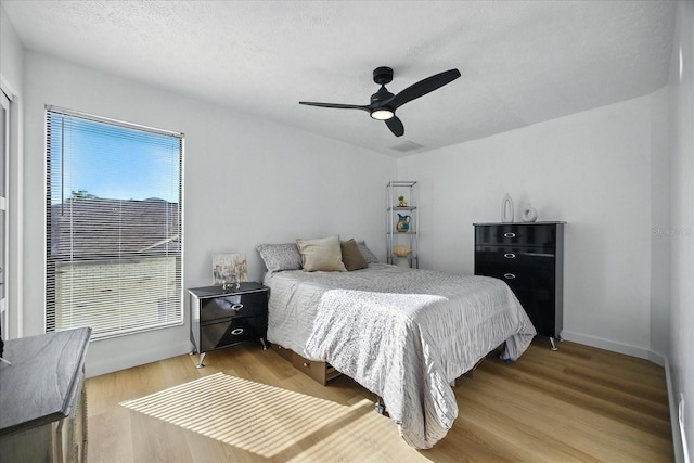 6627 Dolphin Cove Dr, Apollo Beach, FL 33572 - bedroom with wood finished floors and ceiling fan