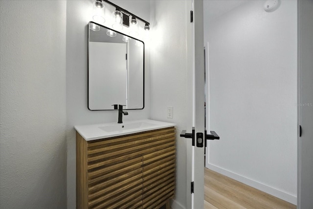6627 Dolphin Cove Dr, Apollo Beach, FL 33572 - bathroom with vanity and wood finished floors