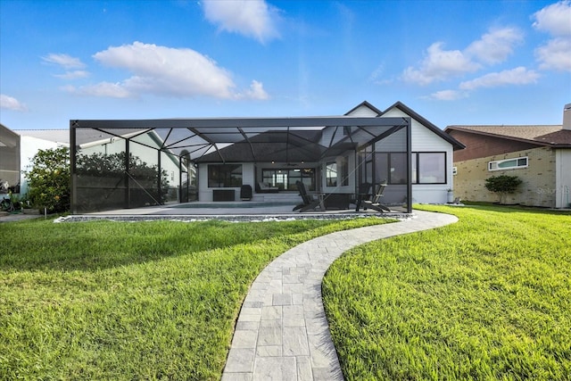 6627 Dolphin Cove Dr, Apollo Beach, FL 33572 - back of property featuring a yard, a patio area, and glass enclosure
