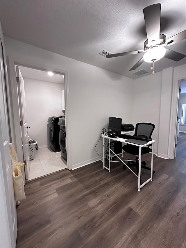 6942 Ripple Pond Loop, Zephyrhills, FL 33541 - office space featuring visible vents, a ceiling fan, dark wood finished floors, and washing machine and clothes dryer