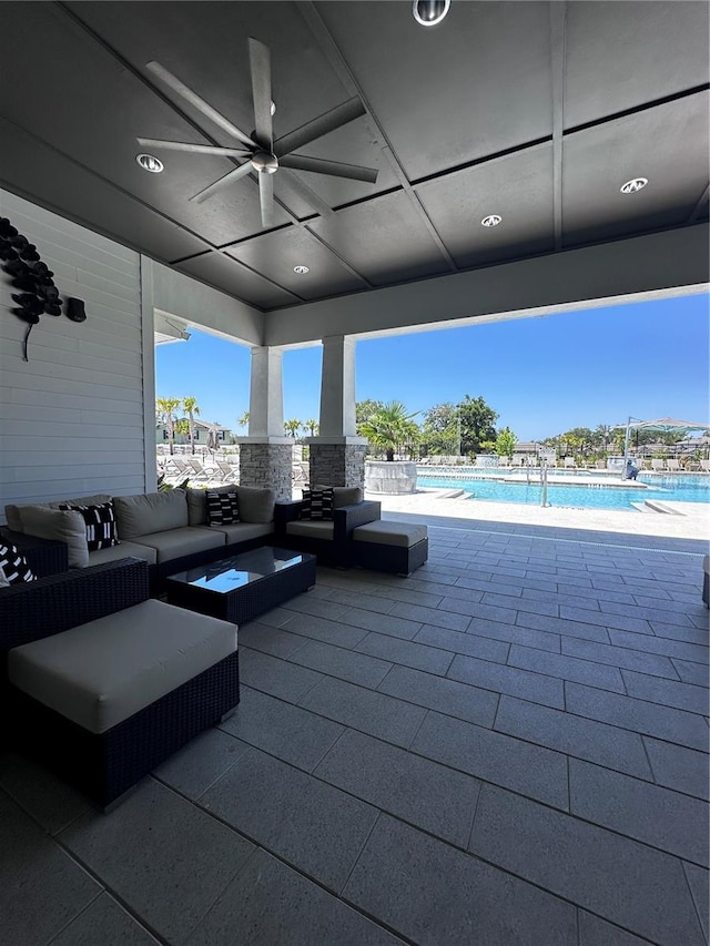 6942 Ripple Pond Loop, Zephyrhills, FL 33541 - view of patio / terrace featuring a community pool, a ceiling fan, and outdoor lounge area