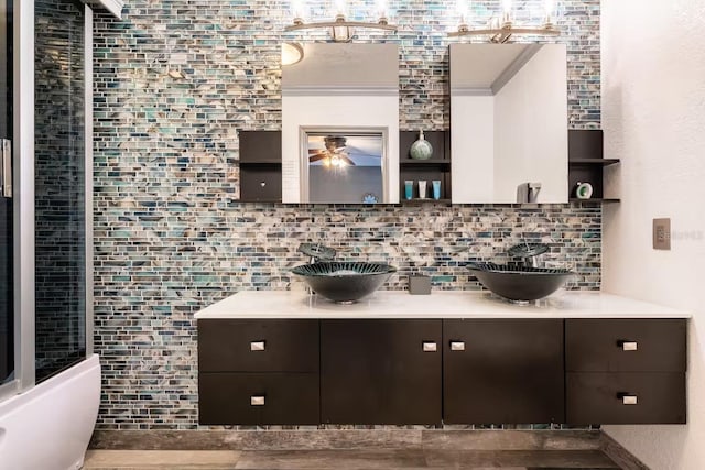 2460 Beacon Groves Blvd, Palm Harbor, FL 34683 - bar featuring a sink, ceiling fan, and tasteful backsplash
