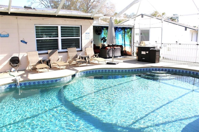2460 Beacon Groves Blvd, Palm Harbor, FL 34683 - outdoor pool featuring glass enclosure and a patio
