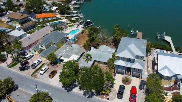 birds eye view of property with a water view and a residential view