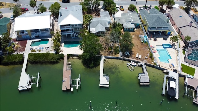 birds eye view of property with a residential view and a water view