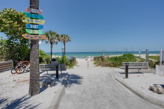 view of community with a view of the beach and a water view