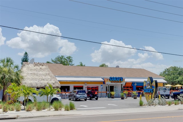 view of building exterior with uncovered parking