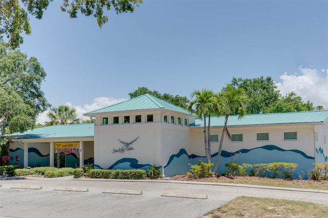 view of property with uncovered parking