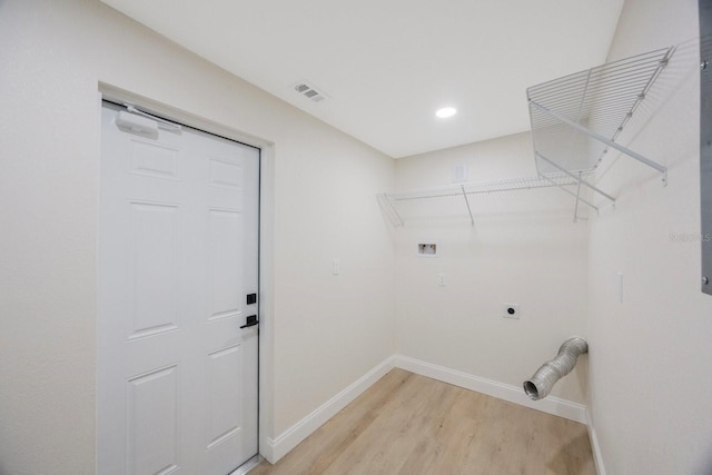 laundry room featuring laundry area, visible vents, hookup for an electric dryer, baseboards, and washer hookup