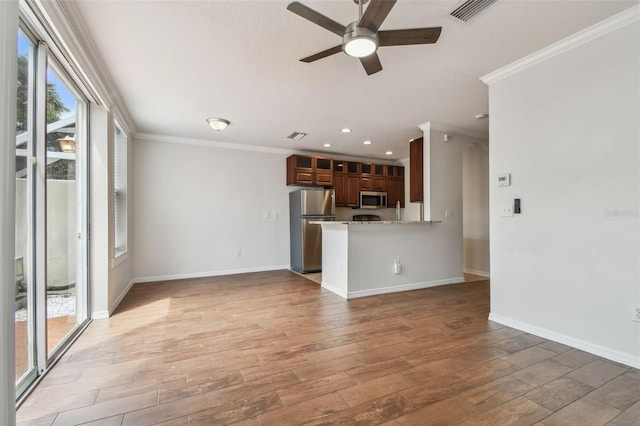 unfurnished living room featuring crown molding, a ceiling fan, light wood-style flooring, and visible vents