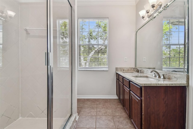 bathroom featuring a sink, a chandelier, a healthy amount of sunlight, and a shower stall