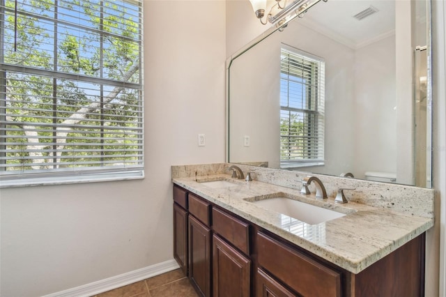 bathroom with a sink, visible vents, and a wealth of natural light