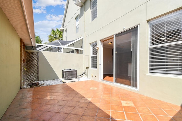 view of patio / terrace with central air condition unit and fence