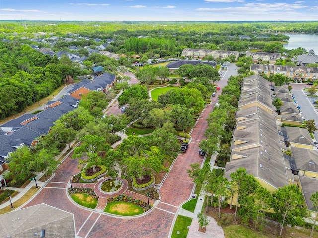 drone / aerial view featuring a water view and a residential view