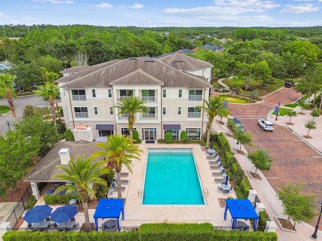 pool featuring a view of trees