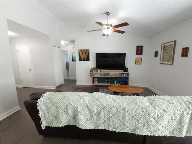 bedroom featuring baseboards, ceiling fan, a closet, and lofted ceiling