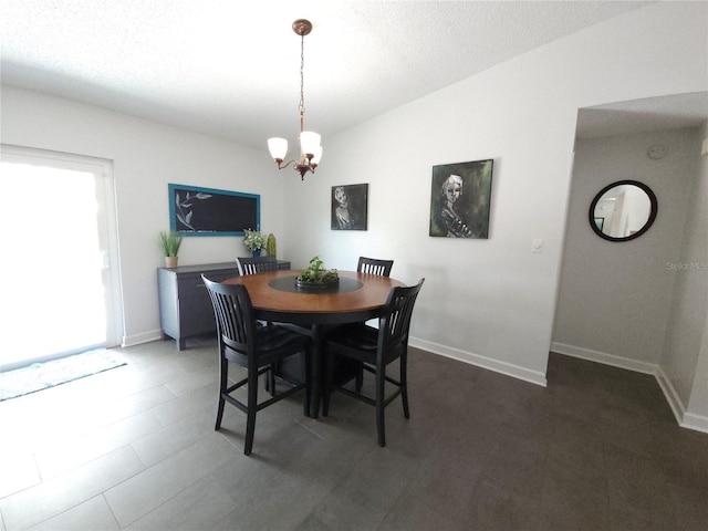 dining room featuring baseboards and a notable chandelier