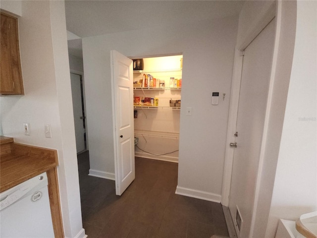 hallway featuring baseboards
