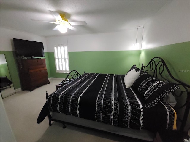 bedroom with baseboards, ceiling fan, and carpet