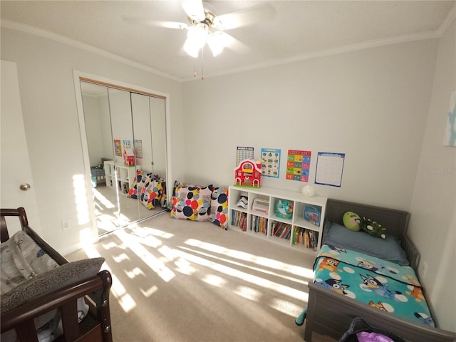 game room with crown molding, carpet, and a ceiling fan