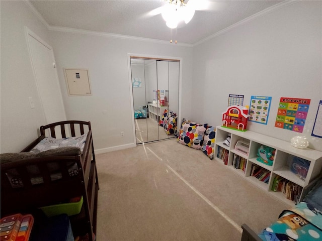 bedroom with carpet flooring, a closet, ornamental molding, and electric panel