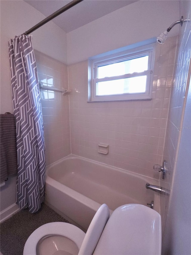 full bath featuring toilet and shower / tub combo