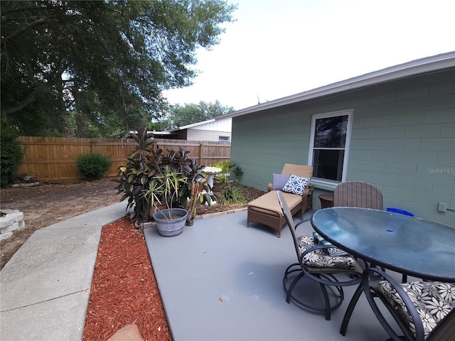 view of patio / terrace featuring fence