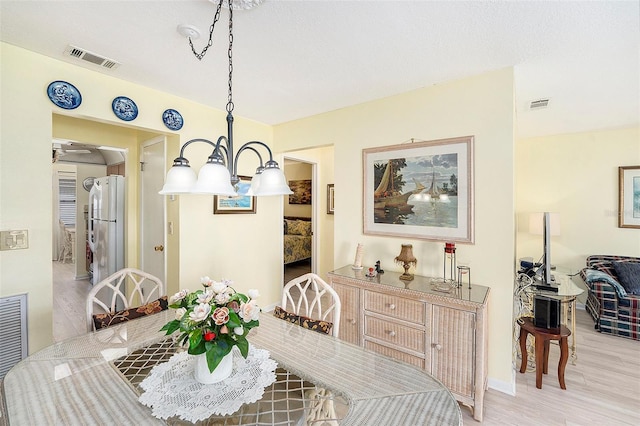 5216 81st St N Unit 2, Saint Petersburg, FL 33709 - dining room featuring light wood finished floors and baseboards