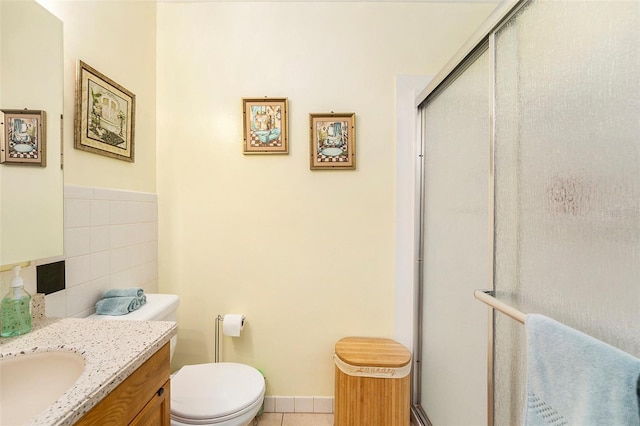 5216 81st St N Unit 2, Saint Petersburg, FL 33709 - bathroom with tile walls, vanity, a shower stall, and tile patterned flooring