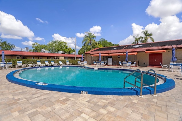 community pool featuring a patio area