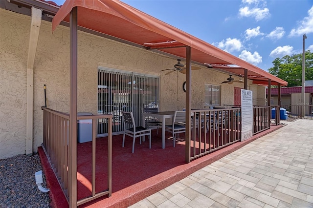 view of patio / terrace featuring a ceiling fan and fence